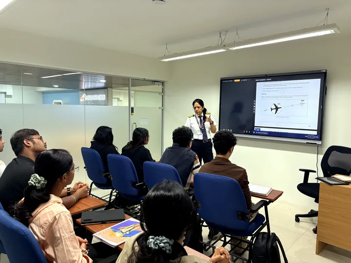 Pilot instructor taking a class of Aerogenesis students