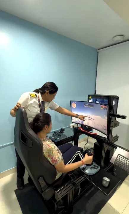 Instructor guiding a student through a simulator lesson