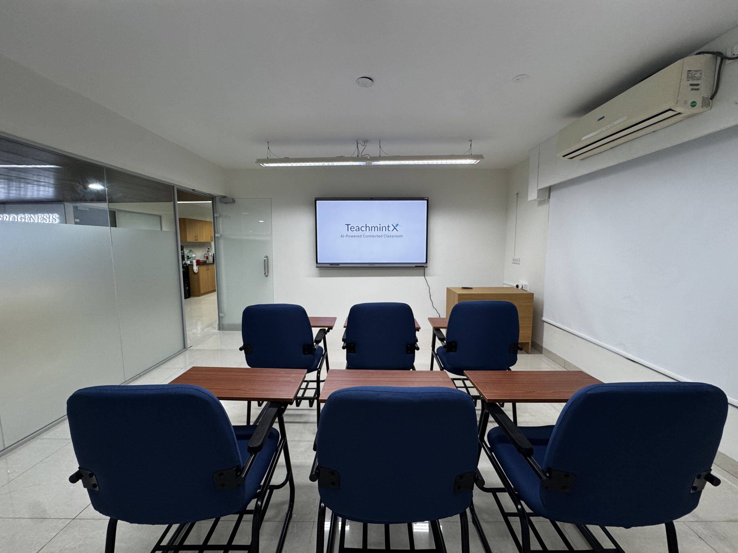 Aerogenesis classroom with smart board and writing desks